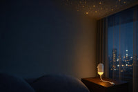 ORYVU Luz de Calma proyectando un cielo estrellado en un dormitorio